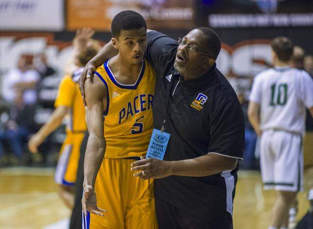 Grant Pacer’s head coach Deonard Wilson hugs Steven after he fouled out during the fourth quarter Friday, March 2, 2018, as the Grant Pacers fell to the St. Mary’s Ram in the CIF Division II Sac-Joaquin Section title game in the Spanos Center at the University of the Pacific. Wilson bowed out of his role as Grant boys basketball head coach after the 2025-26 season.